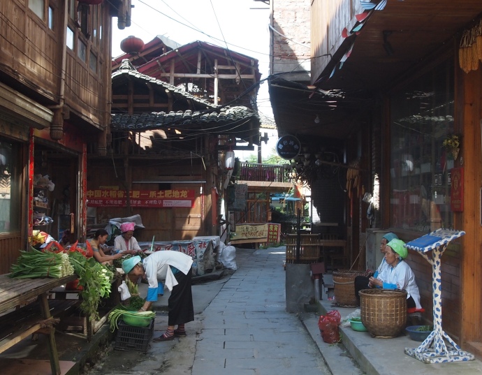 ladies preparing vegetables in the streets of Ping'An